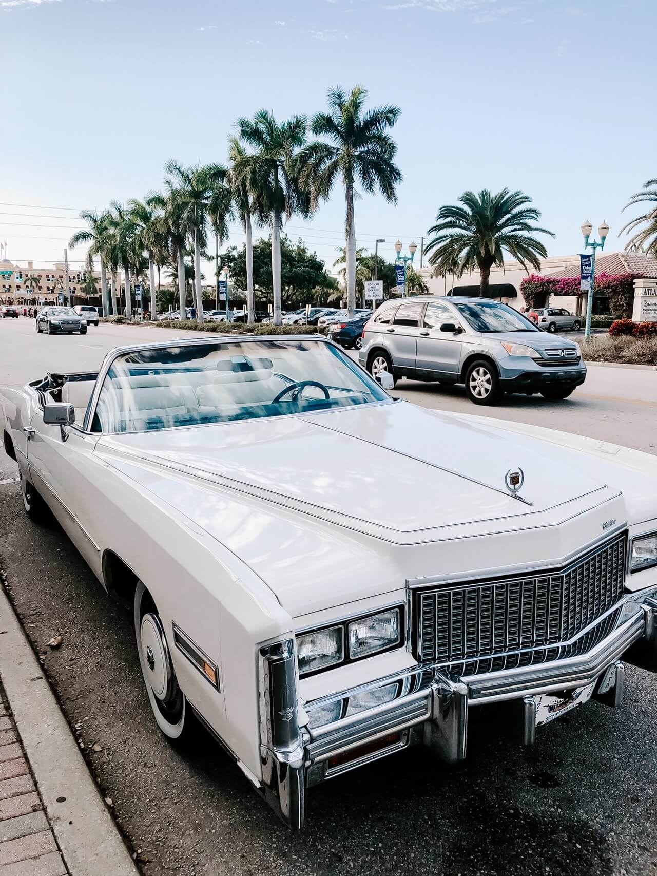 White Cadillac parked on the street 