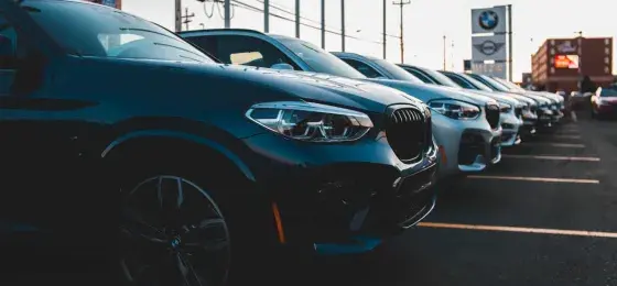 Cars transported to a dealership in a row