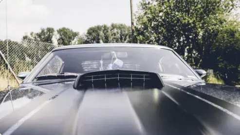 Hood of Black Muscle Car		