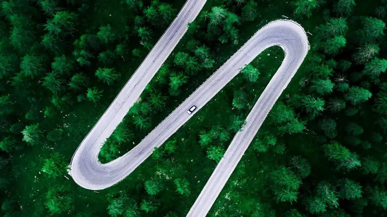A car driving on a road with sharp curves 