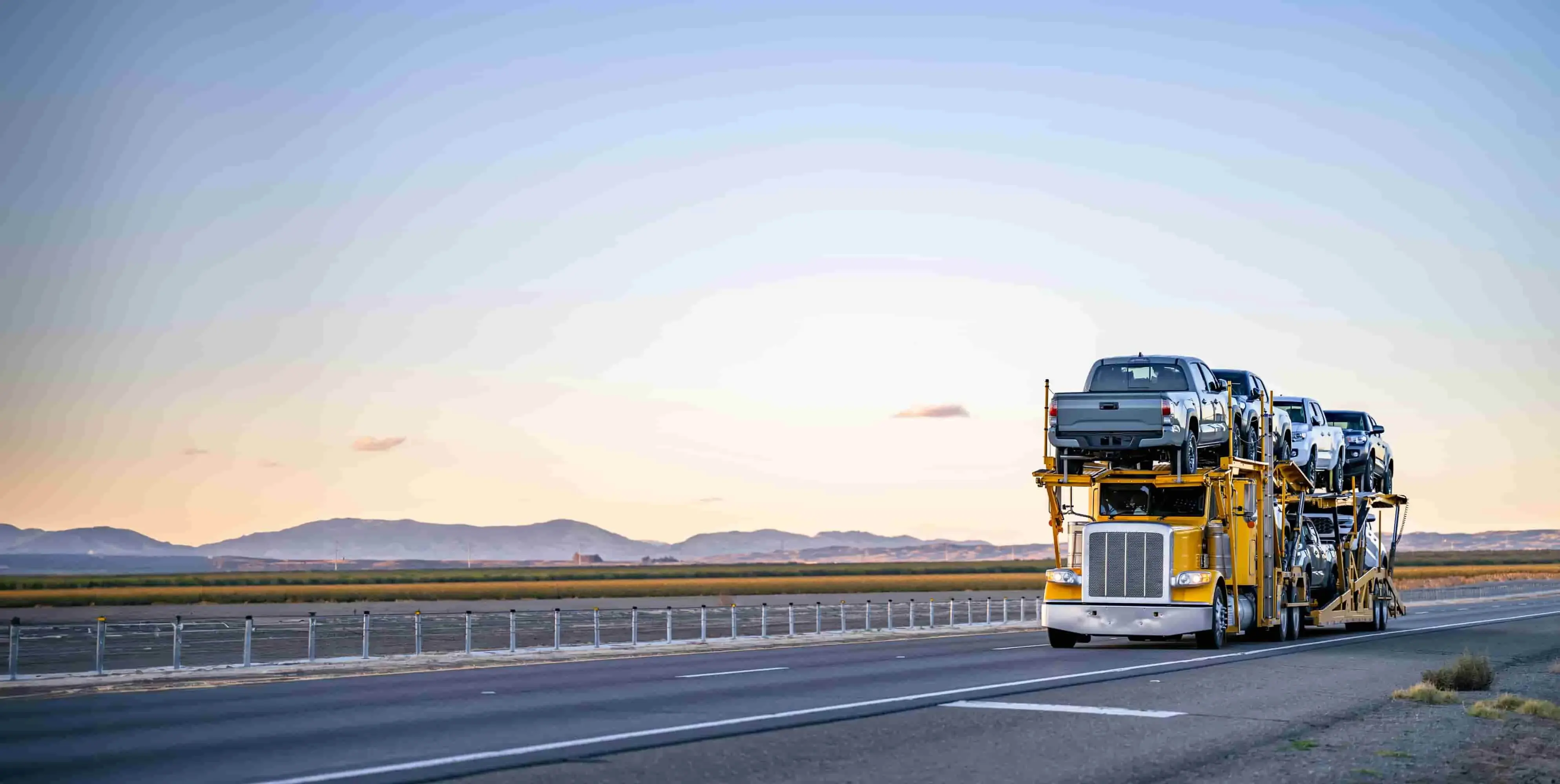 Open Yellow Car Transportation Truck Loaded with cars