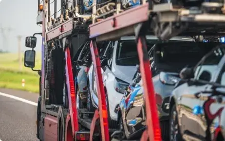 Red truck carrying cars Red truck carrying cars