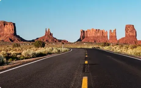 A road passing by rocks A road passing by rocks