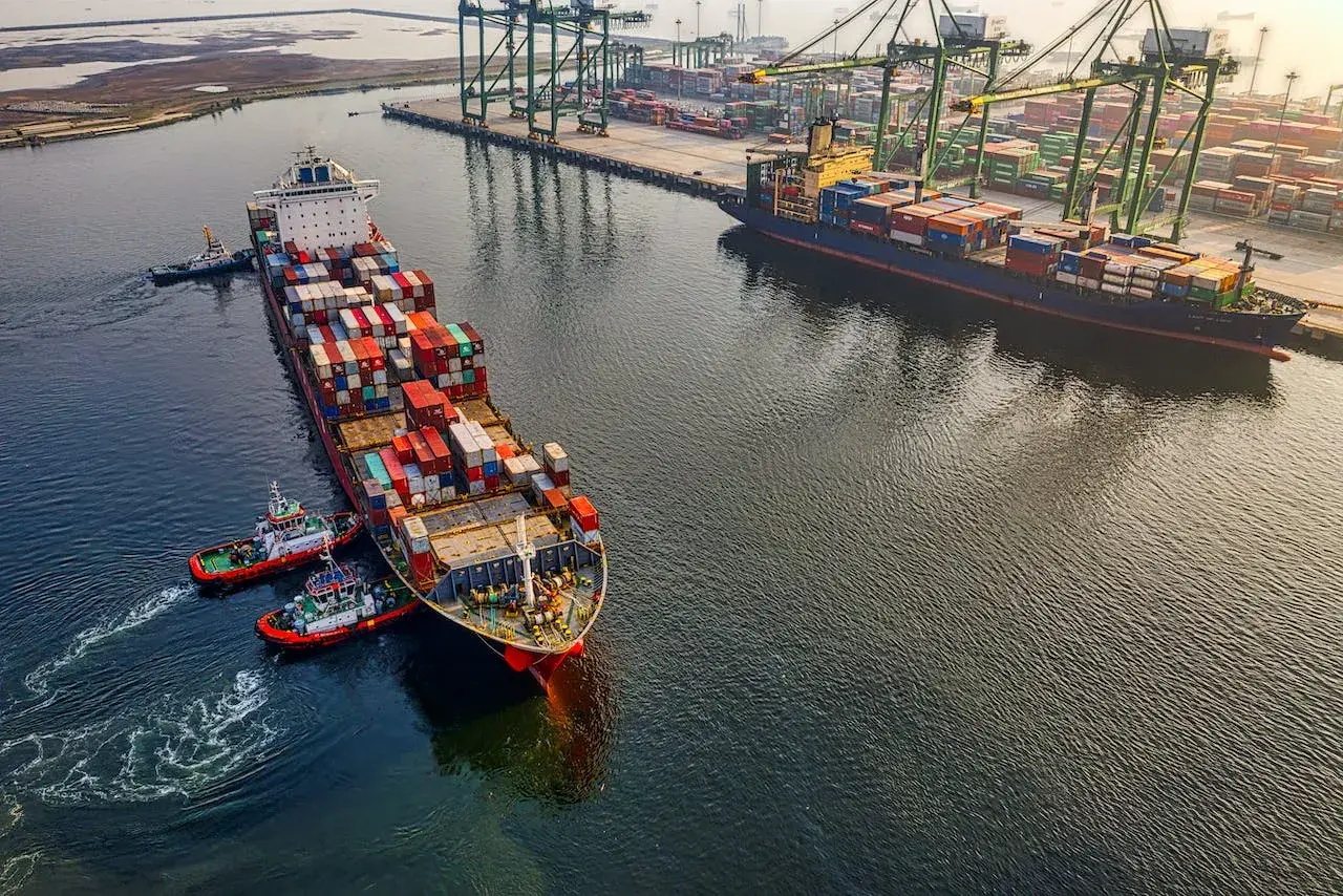 Container ship leaves port Container ship leaves port